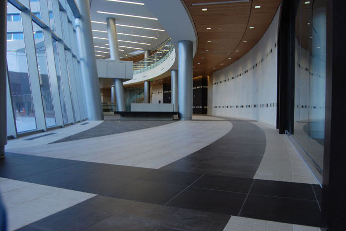 Baylor Cancer Center, curved corridor with a two-tone tile floor along a glass wall