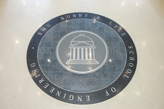 SMU Caruth Hall, waterjet-cut stone floor medallion carrying the Lyle School of Engineering seal