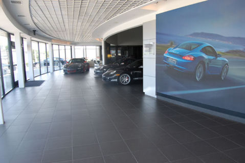 Boardwalk Porsche, showroom floor in large-format dark tile