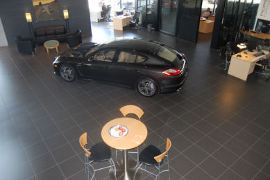 Boardwalk Porsche, showroom with large-format dark tile floor