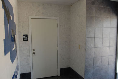 Dallas Christian School field house, tiled corridor wall